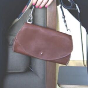 Dean. Crescent shaped leather clutch wallet w/detachable strap
